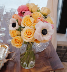 Soft peaches, blushes of pink, and creamy white flowers fill this fluffy and soft bouquet of high-end stems for delivery in Chicago.