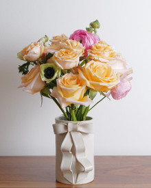 Just Peachy is a flower arrangement of soft peaches, blushes of pink, and creamy white flowers. Made using nothing but high-end stems.