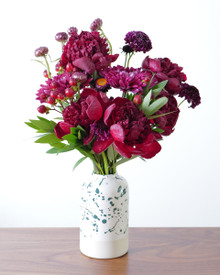 Dark Heart bouquet filled with lush burgundy, wine, and deep purple flowers.