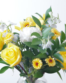 Bright yellow, blue, and white flowers created to celebrate the arrival of a new baby boy.