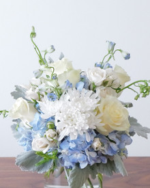 Lake Effect blue and white arrangement displayed in the Flowers by Figgi shop in Chicago