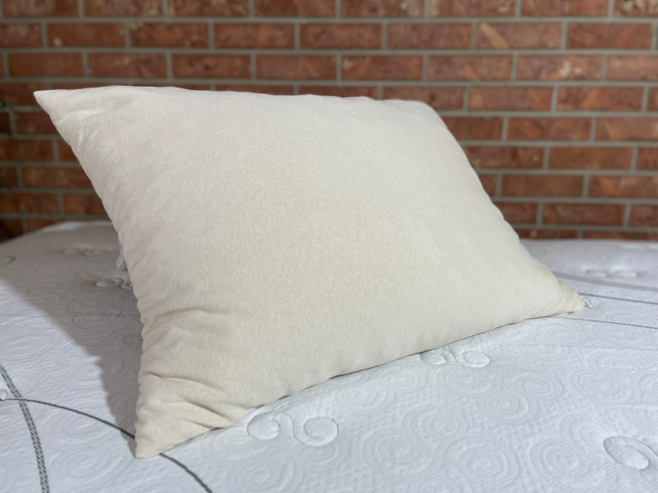 Wool Pillow filled with woolly clusters and an organic cotton zippered shell