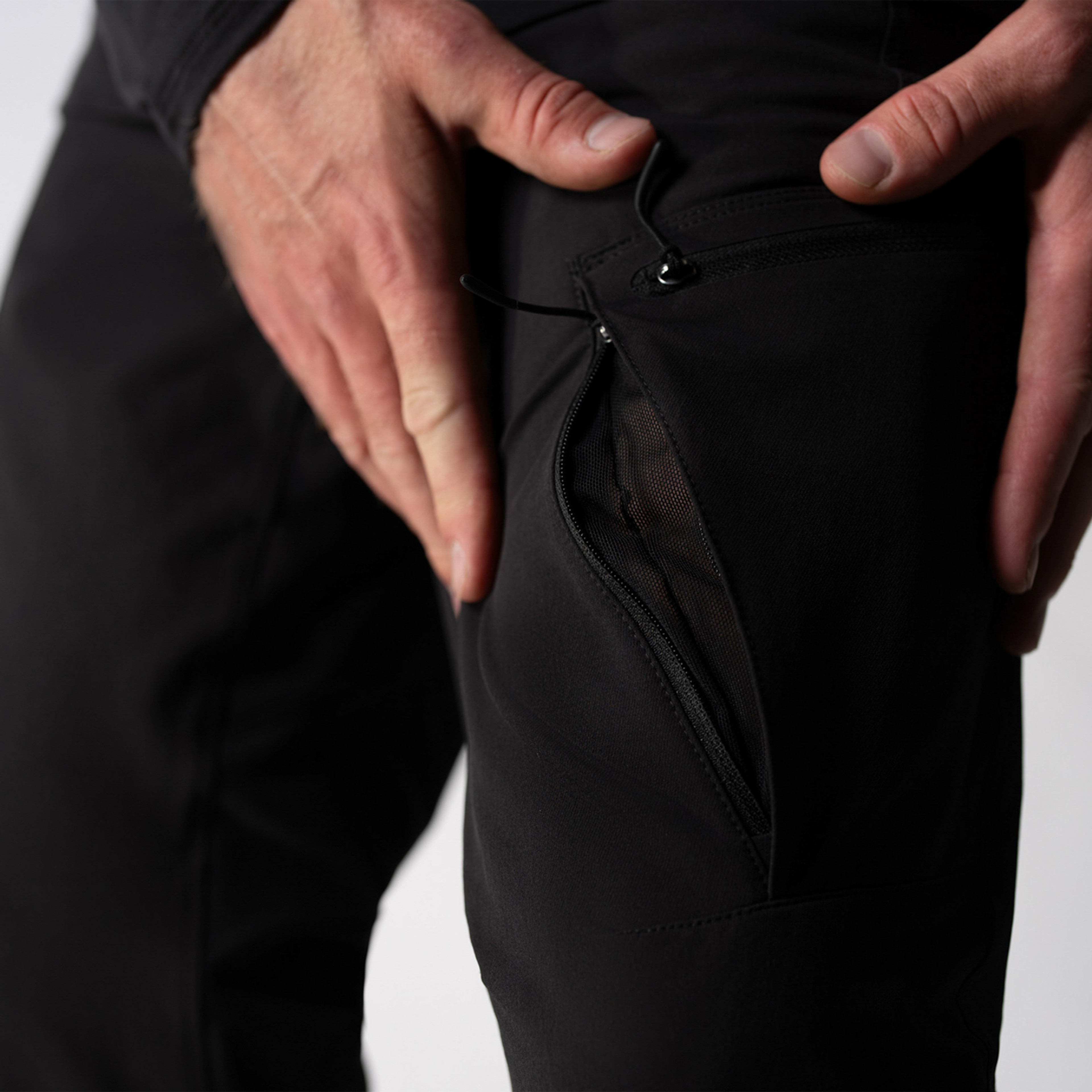 model wearing black pants in the studio