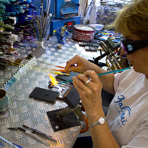 Gail building a glass build in the flame