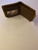 Brown leather wallet with engraved design