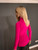 Magenta blouse with high neck and embroidered design in the center and on the sleeves.
one size