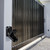 Smart Electronic Key Box, wall mounted next to a gate shown open