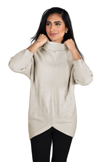 Frank Lyman 213134U oatmeal sweater is a beautiful design, with batwing sleeves, feather design coming in from the sides on both sides with two points at the front, crew neck and so soft to wear.

Hand wash in cold water, hang to dry. 50% rayon, 28% polyester, 22% nylon.

Length from back of neck hem, 26 inches or 80cms, sleeves 26 inches or 66cms.

Lengths differ on different sizes.
