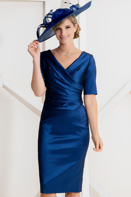 A fitted dress in a simple yet stunningly effective design, a slight sheen to the fabric, with a V neckline and back flowing into a ruched waistline with sleeves worn to the elbow.
Available in different colours.