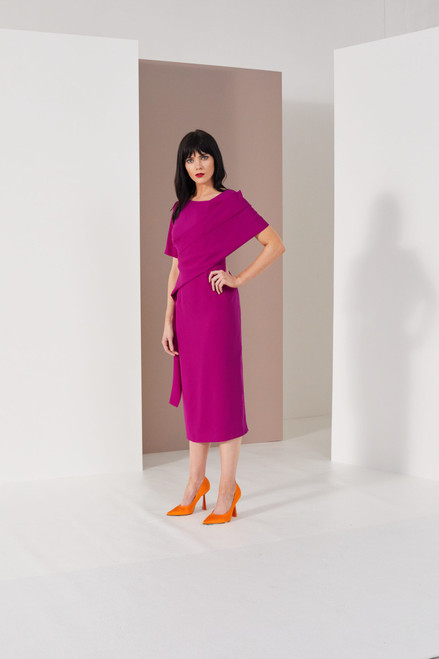 A striking long line shift dress with cross body sash and side drape detail. A truly elegant dress, a show stopping design!