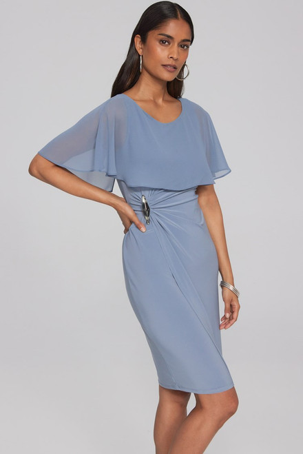Step into elegance with this silky knit sheath wrap dress. Its stunning chiffon cape attached at the shoulders adds a touch of drama. The side of the dress features a delicate gathering and a silver metal ornament for a chic finish. Complete with an invisible zipper at the center back, this dress is fully lined for comfort. Part of the Signature Collection.