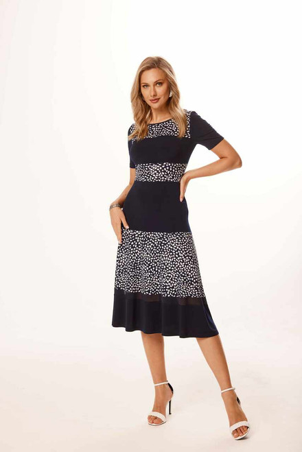 Indulge in the timeless elegance of this beautiful and comfortable dress, featuring short sleeves and a flattering a-line silhouette that enhances your natural grace. The dress exudes a sense of sophistication navy blue color palette, creating a stunning combination that is both classic and chic.