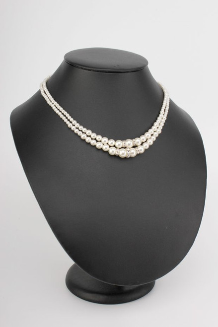 Traditional two-row pearl necklace with a touch of silver crystal. With matching pearl stud earrings.