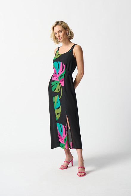 Step into paradise with a tropical printed georgette maxi dress featuring solid georgette at the sides. A straight silhouette embraces comfort, complete with a playful tie at the back. Eyelet details on the straps add charm to the sleeveless design. A summer essential.