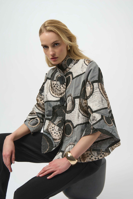 Joseph Ribkoff Abstract Jacquard Trapeze Jacket (254003). 

This elegant jacquard jacket boasts an airy trapeze silhouette, an alluring abstract print, and stunning three-quarter sleeves with delicate tulip cuffs. A stand collar and back double pleat add refined structure, while the front button-down closure lends a polished feel to the garment.