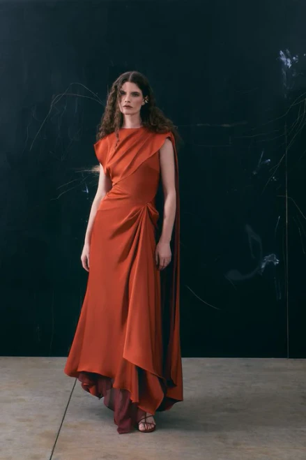 The Maisonel ME3224 midi dress combines elegant design and versatile style in a rich terracotta . Featuring a classic boat neck and a draped bodice scarf detail, this dress highlights a sophisticated silhouette perfect for formal occasions. Crafted from premium-quality materials, it offers both comfort and durability for timeless wear. Ideal for weddings, evening events, and other special gatherings.