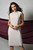 219014 Frank Lyman Pleat Dress With Pearl And Diamate Neck. pleat sheath dress style. knee length dress. sleevless. almond colour.