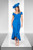 A lively cobalt blue dress featuring an off-the-shoulder design, front frill, and a hi-lo hemline. Ideal attire for a contemporary mother of the bride or groom, or as a stylish choice for a wedding guest.