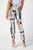 Crafted with a delightful patchwork print, these millennium cropped Trousers features a structured contour elastic waistband for a flattering fit. Adding a touch of sophistication is the JR ornament at the back, elevating the overall charm. The inseam of 27 inches provides a trendy cropped style. Made from a luxurious fabric that drapes beautifully, this trouser feels indulgently soft against your skin. It's perfect for a summer soirée or a casual day out with friends.