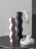 Elevate your decor with "Courbe" by TUTU: A high-quality, handcrafted ceramic vase that exudes elegance and style.