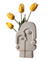 a ceramic face vase