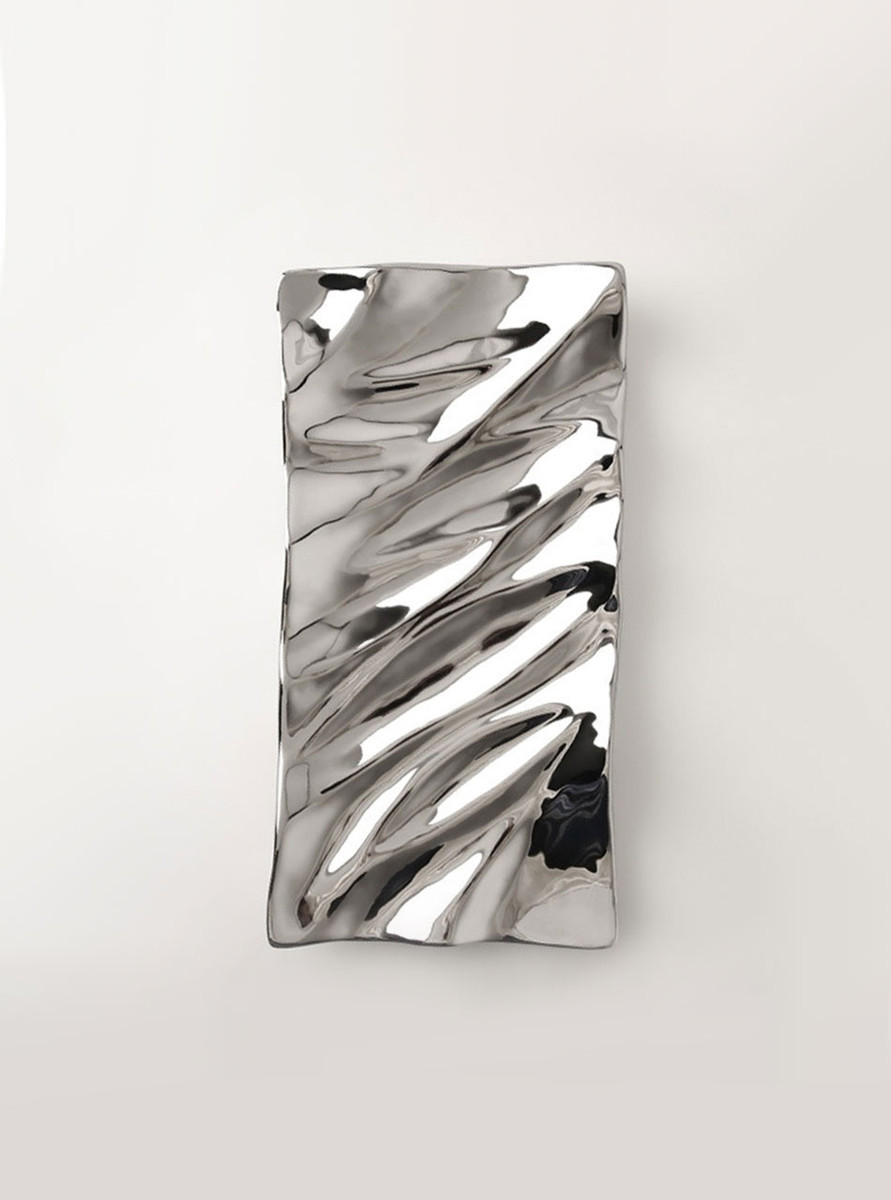 Silver tray with wave design - perfect for entertaining. Adds sophistication to any tabletop setting. Silver tray with wave design - perfect for entertaining. Adds sophistication to any tabletop setting.