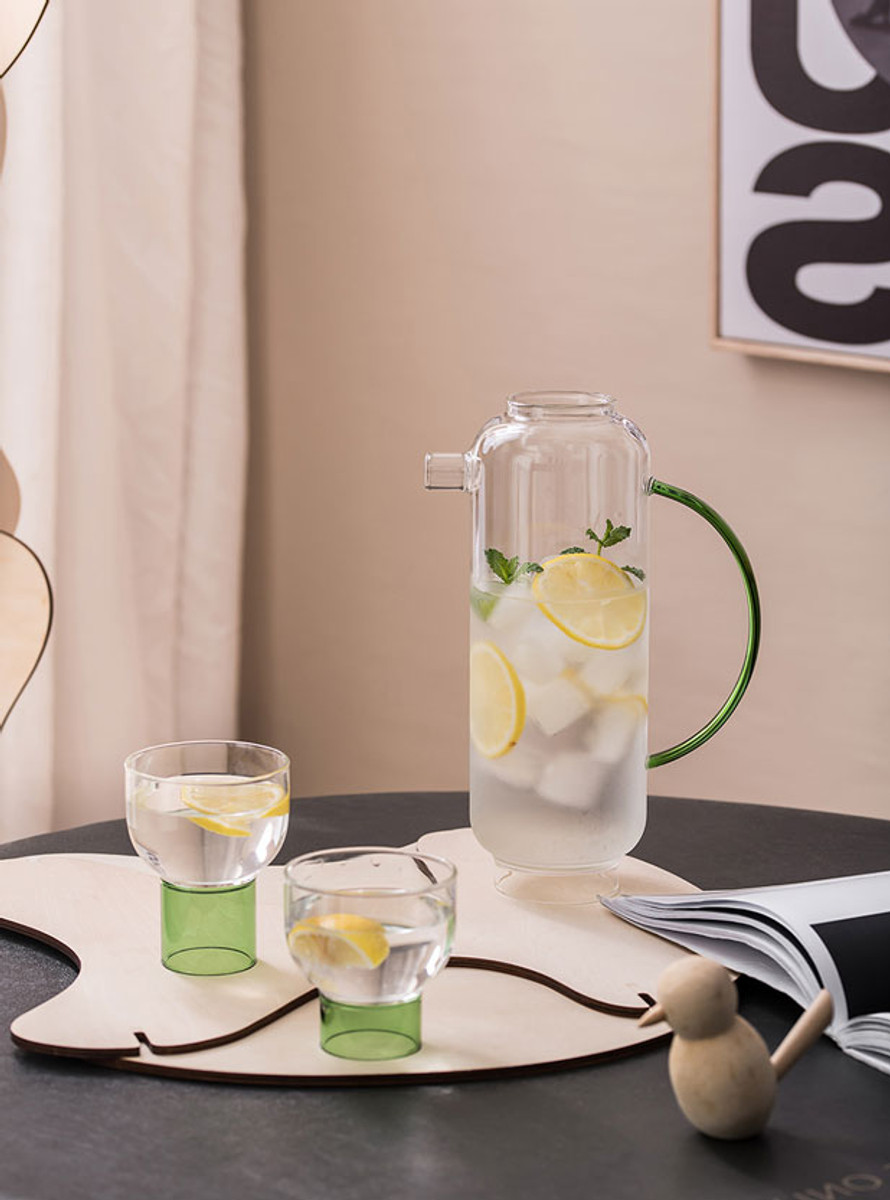 Delicate tea set with lemon water