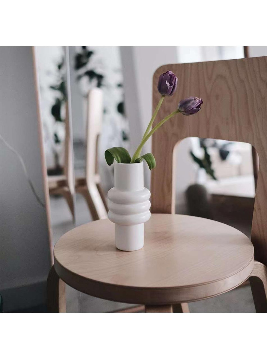 Bring some fun and sophistication to your home with the "Little Michelin" vase by TUTU Home. Made from high-quality kaolin and finished with a white satin touch, this vase's unique loopy design inspired by the Michelin Man will make it a standout piece in any room. Bring some fun and sophistication to your home with the "Little Michelin" vase by TUTU Home. Made from high-quality kaolin and finished with a white satin touch, this vase's unique loopy design inspired by the Michelin Man will make it a standout piece in any room.