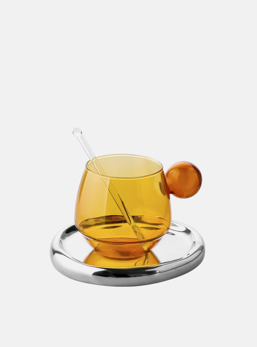 The front view of the mix-coloured amber glass cup