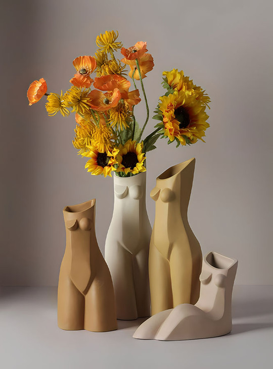Handcrafted ceramic vase with a body-shaped design adds elegance to any room.