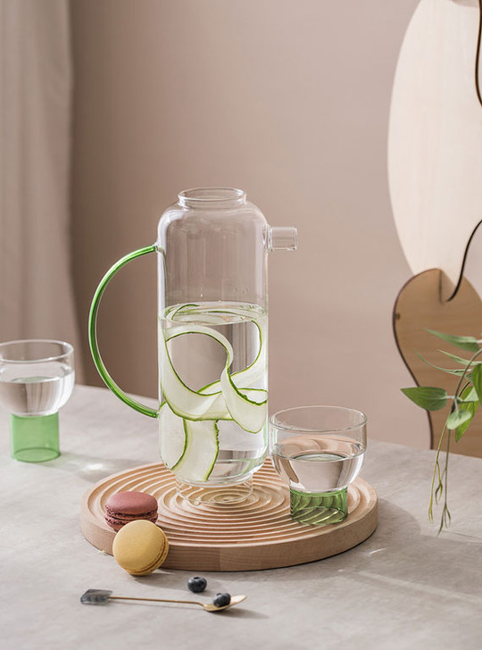 Delicate tea set with cucumber water