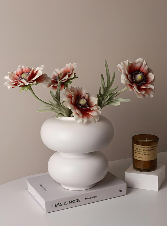 Elevate your floral displays with the unique and charming "Michelin" vase by TUTU.