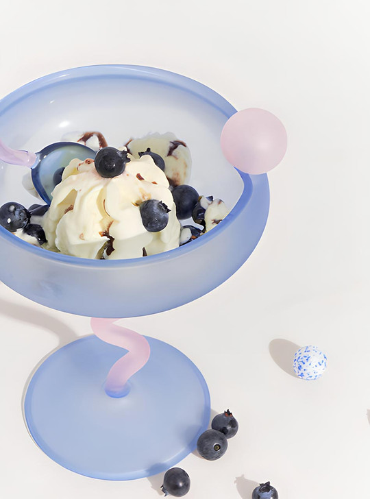 blue coupe glass with dessert