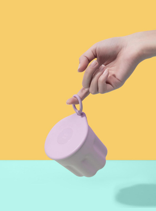 hand with purple travel mug