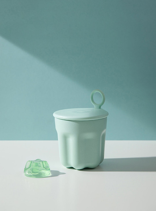 mint green jelly mug on the table