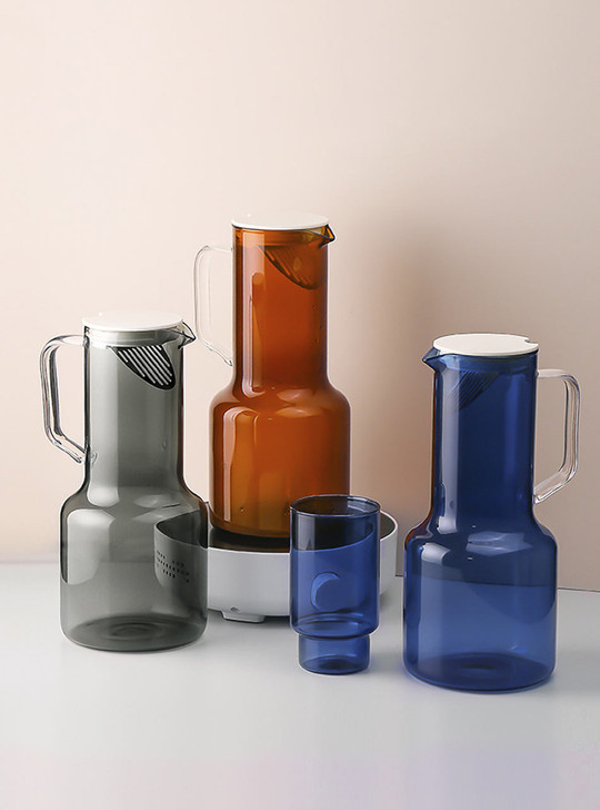different coloured glass jug on the table