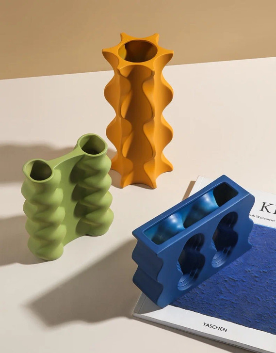 3 different coloured architecture vases