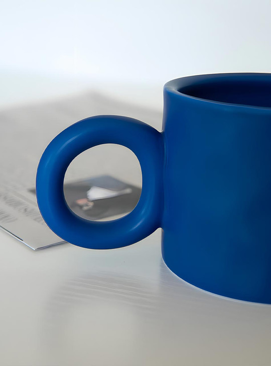 Enjoy beverages or desserts in style with TUTU's Bague Cup, made of high-quality porcelain.