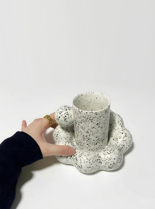 Experience art and functionality with the TUTU Cloud ceramic mug.