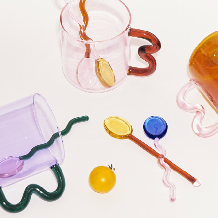 colourful water glass with wavy handle