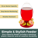 Festive Flower 32 oz. Hummingbird Feeder: Simple & stylish feeder - 32 oz. capacity feeder includes a teardrop plastic reservoir and all-weather durability. 32 oz. nectar capacity, easy nectar monitoring, weather resistant.