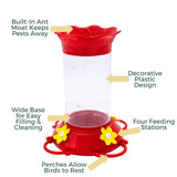 Petit Fleur 22 oz. Hummingbird Feeder: Built-in Ant moat keeps pests away, decorative plastic design, wide base for easy filling & cleaning, four feeding stations, perches allow birds to rest.