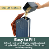 Navy Hopper Birdfeeder: holds 4.25 lbs. of seed, Easy to fill - lift off roof to fill. Easily load birdseed using North States Feeder Filler Scoop (sold separately)