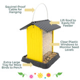Fiesta Yellow Hopper Birdfeeder features a squirrel-proof cable for hanging, lift roof to easily fill feeder, clear plastic windows to monitor seed levels, extra-large tray for more birds to perch.