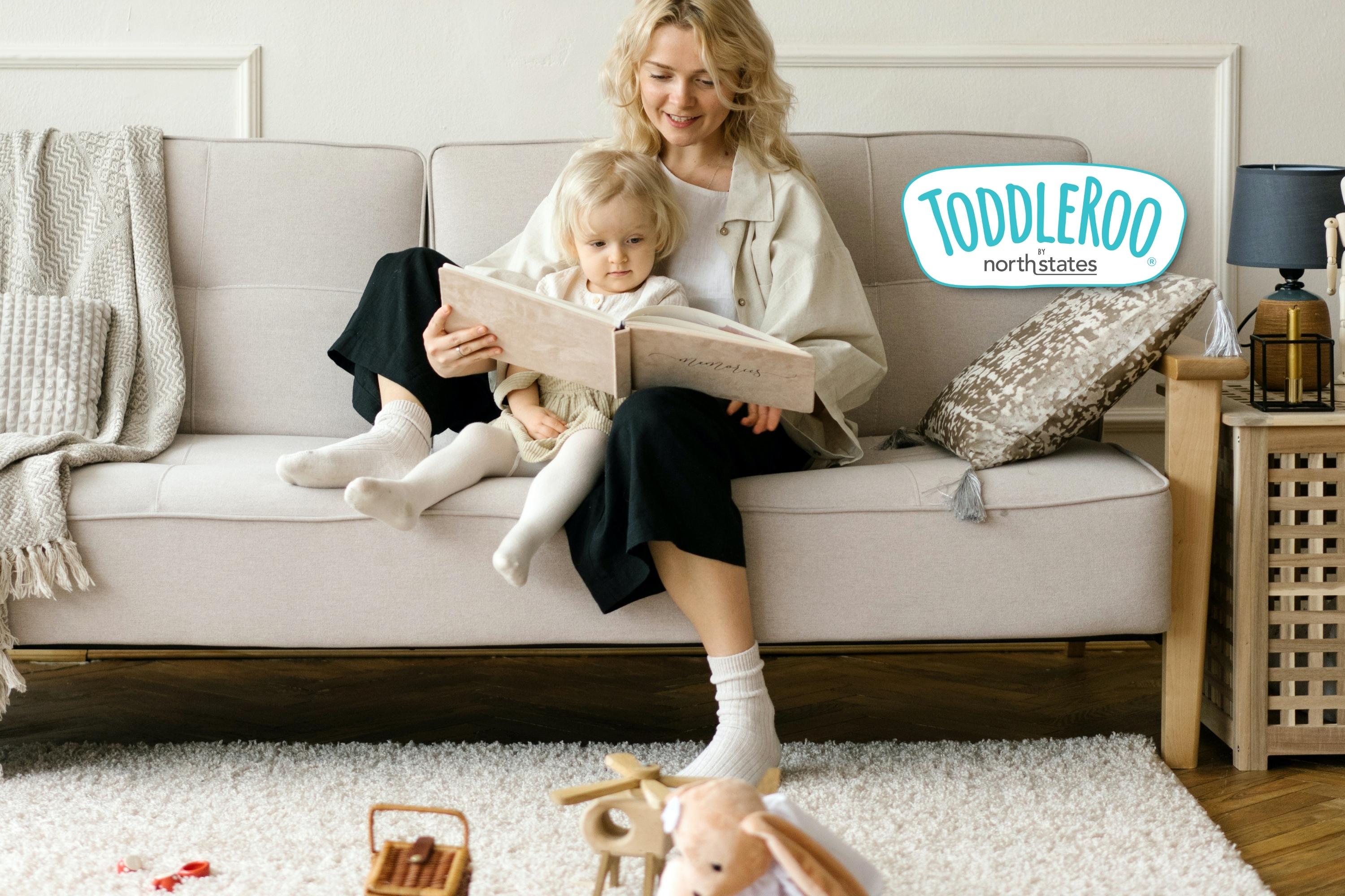 Mom reading a book with baby on her lap