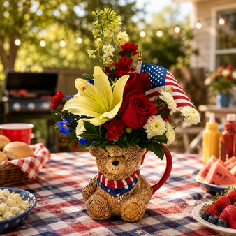 Patriot Bear Bouquet sitting on a picnic table