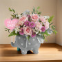 Pink and white floral arrangement featuring roses and chrysanthemums displayed in a gray polka-dot elephant keepsake vase with a â€˜Hello Babyâ€™ sign, perfect for welcoming a newborn or baby shower gift. Standard Size