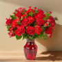 Key to My Heart Bouquet premium featuring red roses, carnations, and greenery arranged in a red glass vase