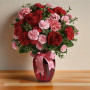 Dance with Me Bouquet featuring red roses and pink carnations arranged in a red glass vase with ribbon, romantic flower arrangement by local florist