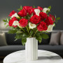 Forever Yours Bouquet featuring red roses and white calla lilies arranged in a white fluted ceramic vase, romantic flower arrangement by local florist